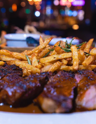 Grilled 16oz. Ribeye Served With Broccoli, Bell Peppers and Demi-Glaze